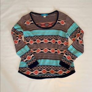 Coral, navy and teal patterned sweater.